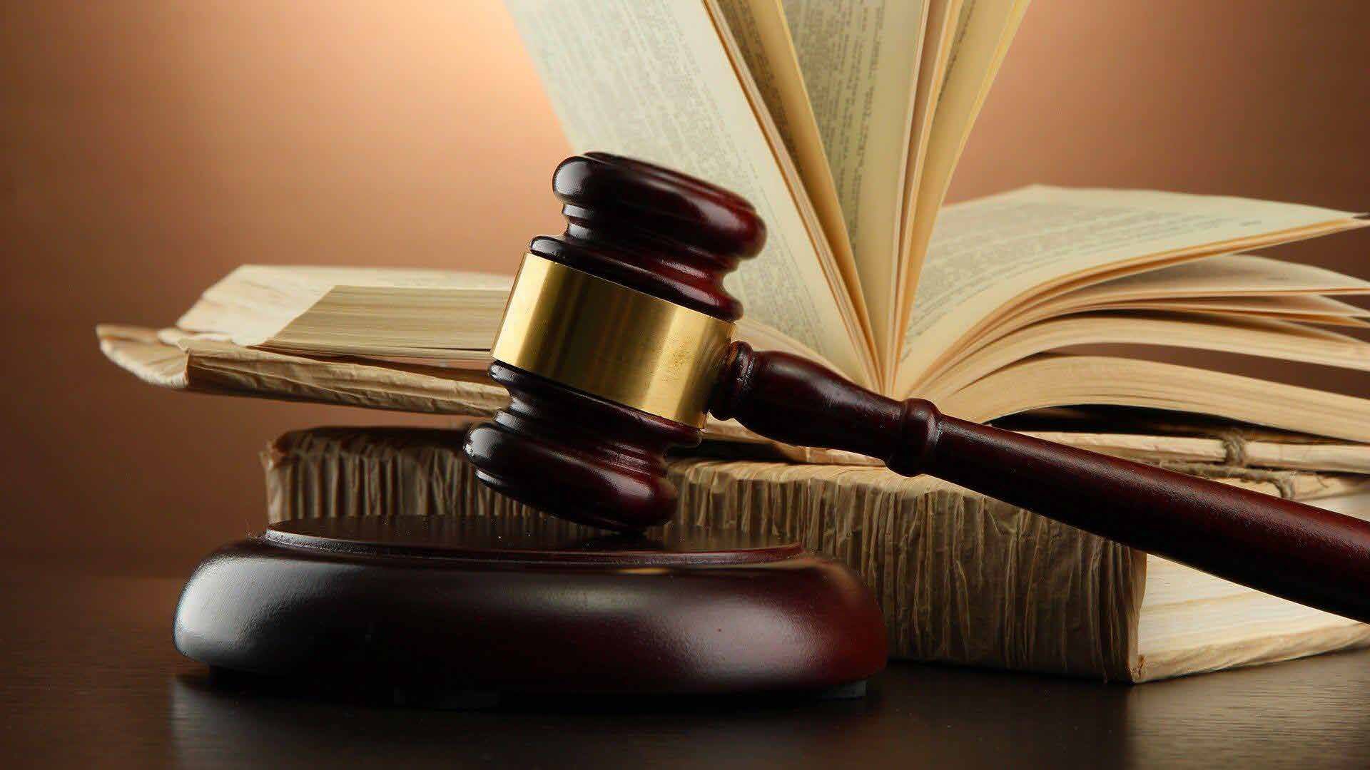 Gavel resting on legal texts